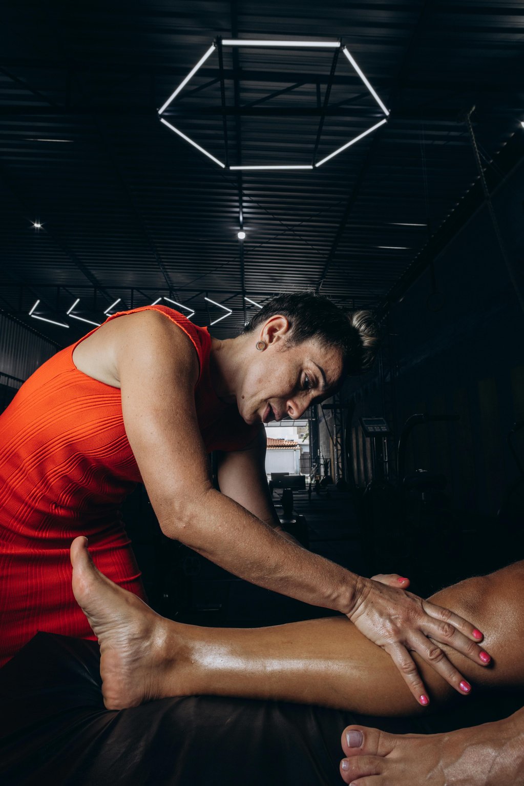 A woman getting a massage in a gym